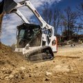 Bobcat T595 Compact Track Loader dumping a load of dirt