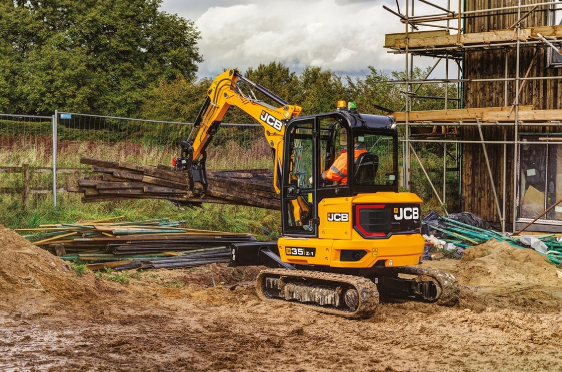 JCB 35Z-1 Mini Excavator grappling scrap wood