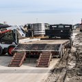 Bobcat S510 Skid Steer Loader loading flat deck trailer