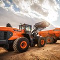 DEVELON DL420-7 Wheel Loader dumping load into DEVELON DA45 articulated dump truck