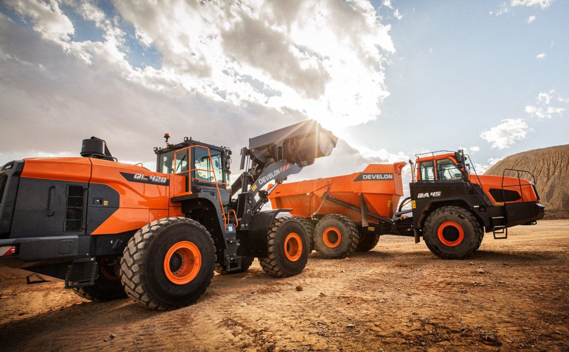 DEVELON DL420-7 Wheel Loader dumping load into DEVELON DA45 articulated dump truck