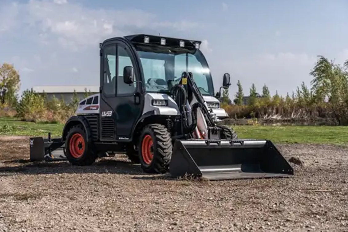 Bobcat UW53 Toolcat grading a field