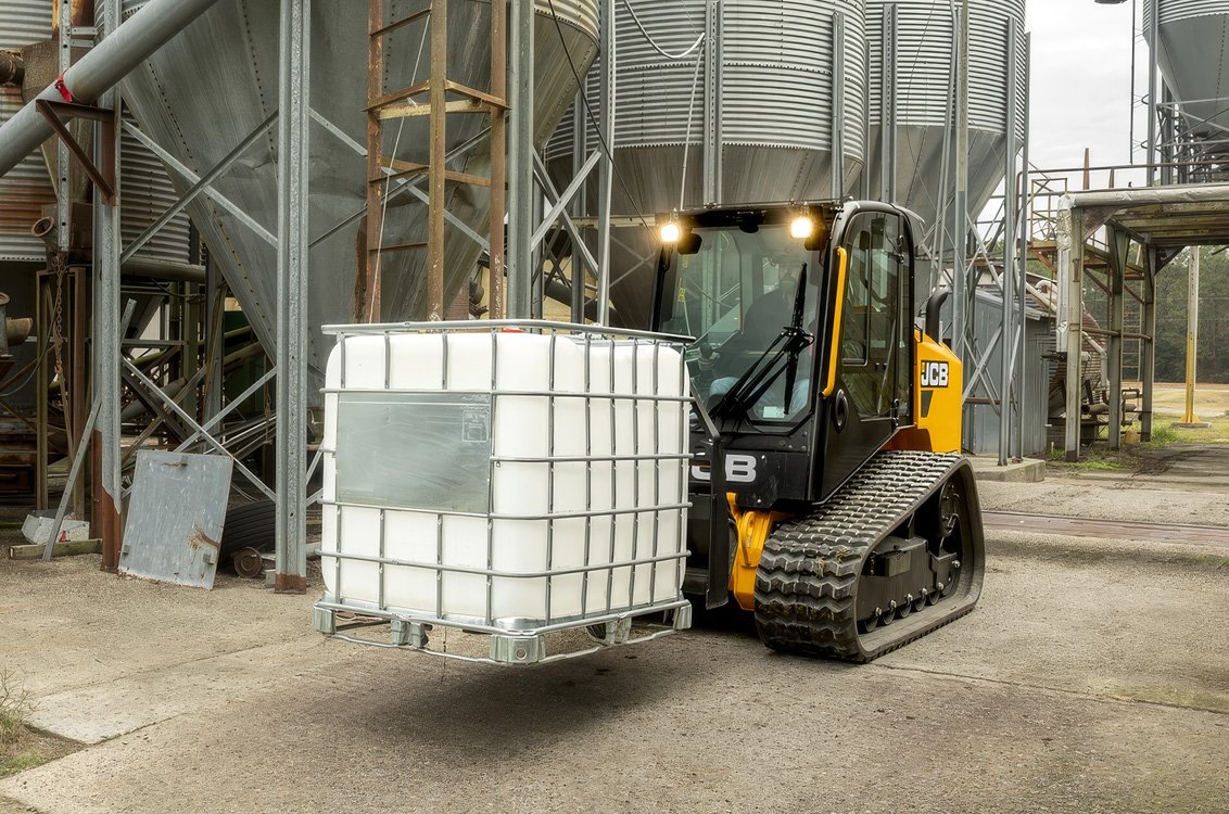 JCB 270T Compact Track Loader hauling water supplies industrial setting