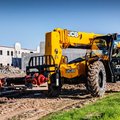 JCB 509-42 Telehandler hauling a heavy fire hydrant system