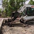 Bobcat T650 Compact Track Loader dumping a load of dirt