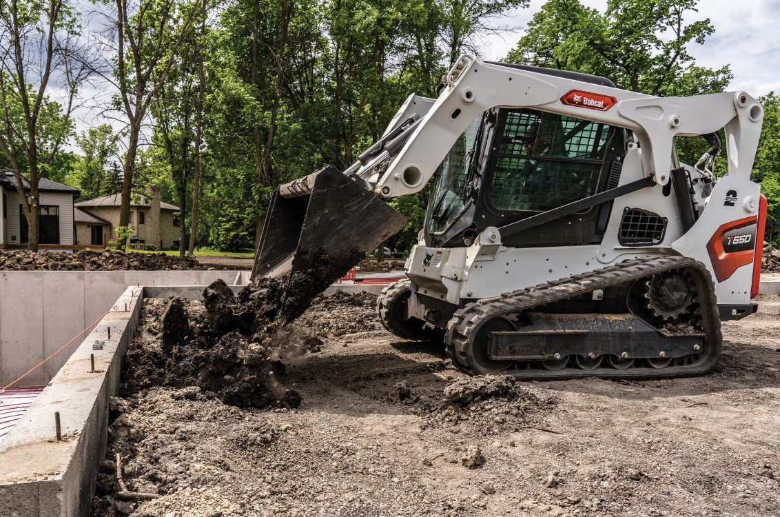 Bobcat T650 Compact Track Loader dumping a load of dirt