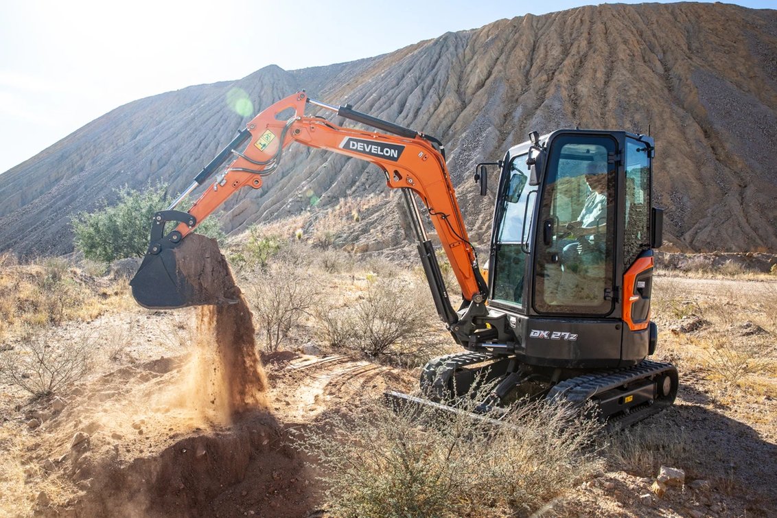 DEVELON DX27Z-7 Mini Excavator digging dirt