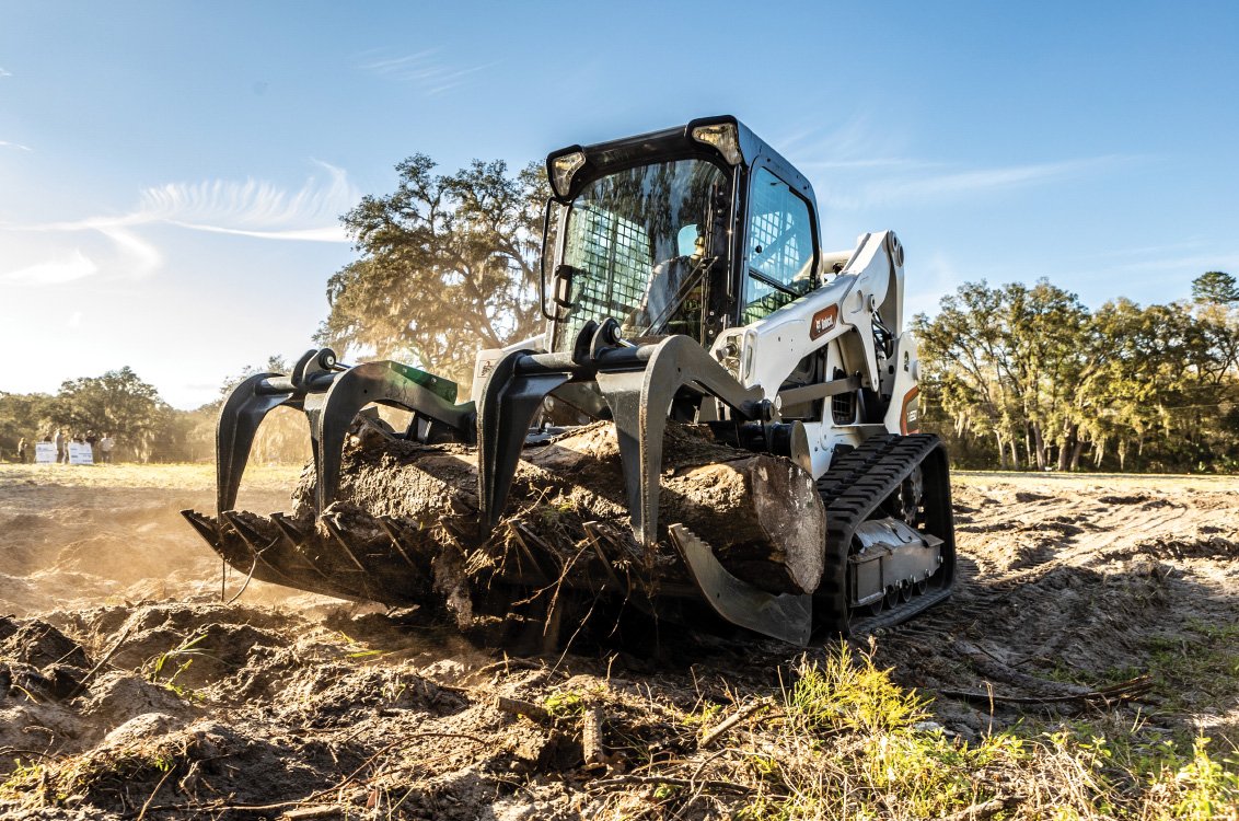 Bobcat T650 Compact Track Loader with a root grapple