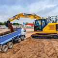 JCB 131X Crawler Excavator loading a dump truck