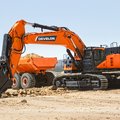 DEVELON DX800LC-7 Crawler Excavator digging then loading into an ADT
