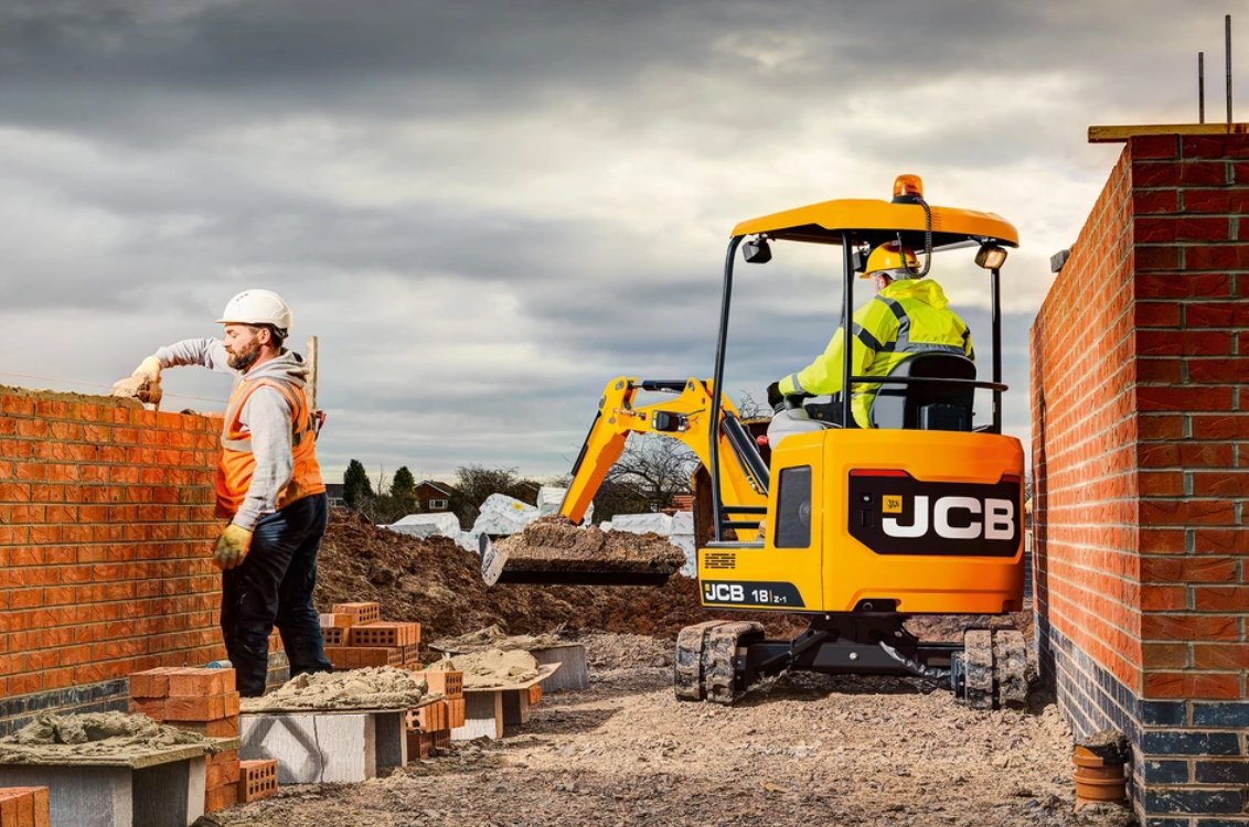 JCB 18Z-1 Mini Excavator moving earth in a tight space