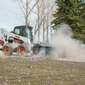 Bobcat S770 Skid Steer loader with Sweeper attachment