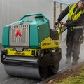 Ammann ARW 65 Walk-Behind Roller paving a lot