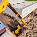 JCB 510-56 Telehandler stacking heavy material in a high location