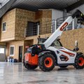 Bobcat TL623 Telehandler loading a pallet of fertilizer into a high loft