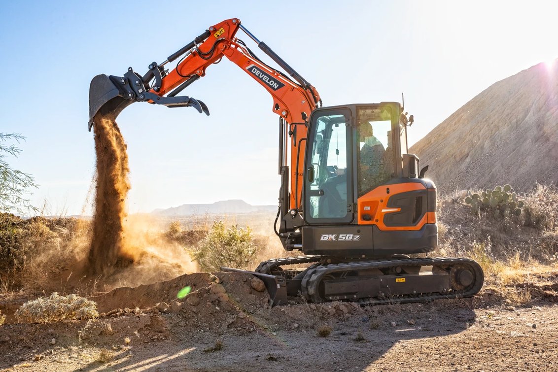 DEVELON DX50Z-7 Mini Excavator digging a trench