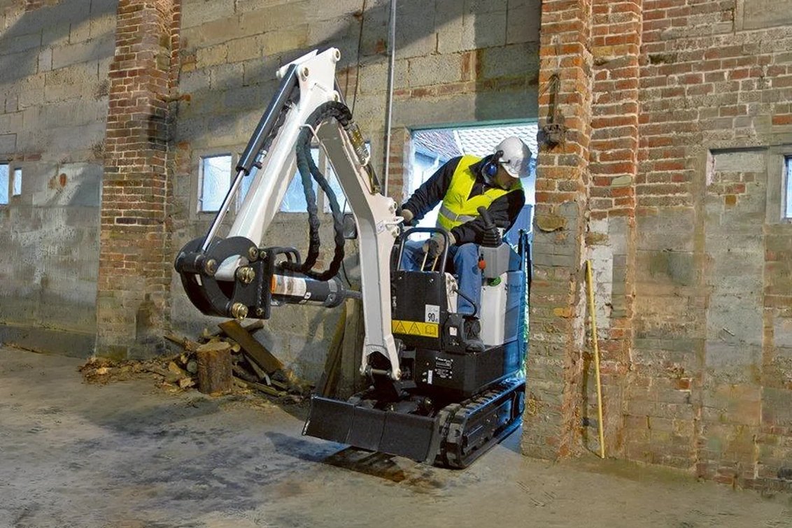 Bobcat E10 Mini Excavator in a narrow construction doorway