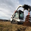 Bobcat T450 Compact Track Loader drilling soil