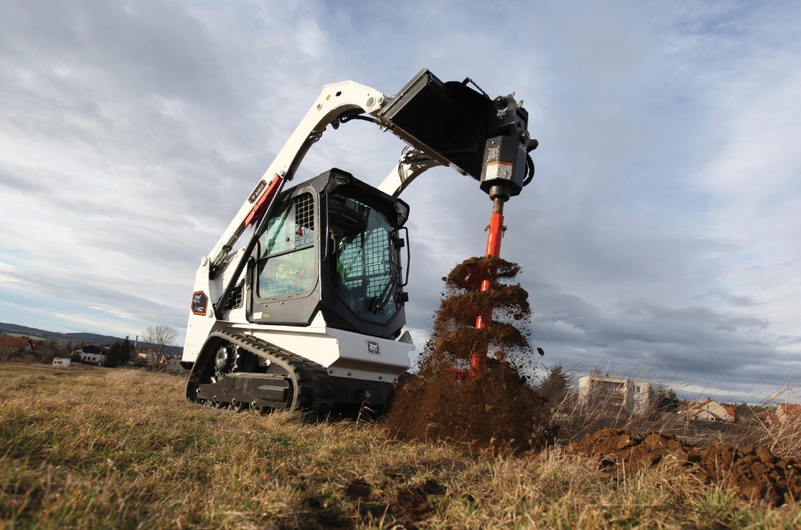 Bobcat T450 Compact Track Loader drilling soil