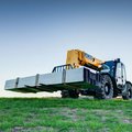 JCB 507-42 Telehandler hauling steel construction material