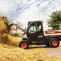 Bobcat UW56 Toolcat gathering straw