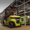 Clark S30XE Renegade Electric Rider Pneumatic Forklift working in outdoor warehouse