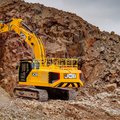 JCB 370X Crawler Excavator taking down a slope