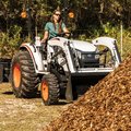 Bobcat CT2025 HST Compact Tractor hauling wood mulch