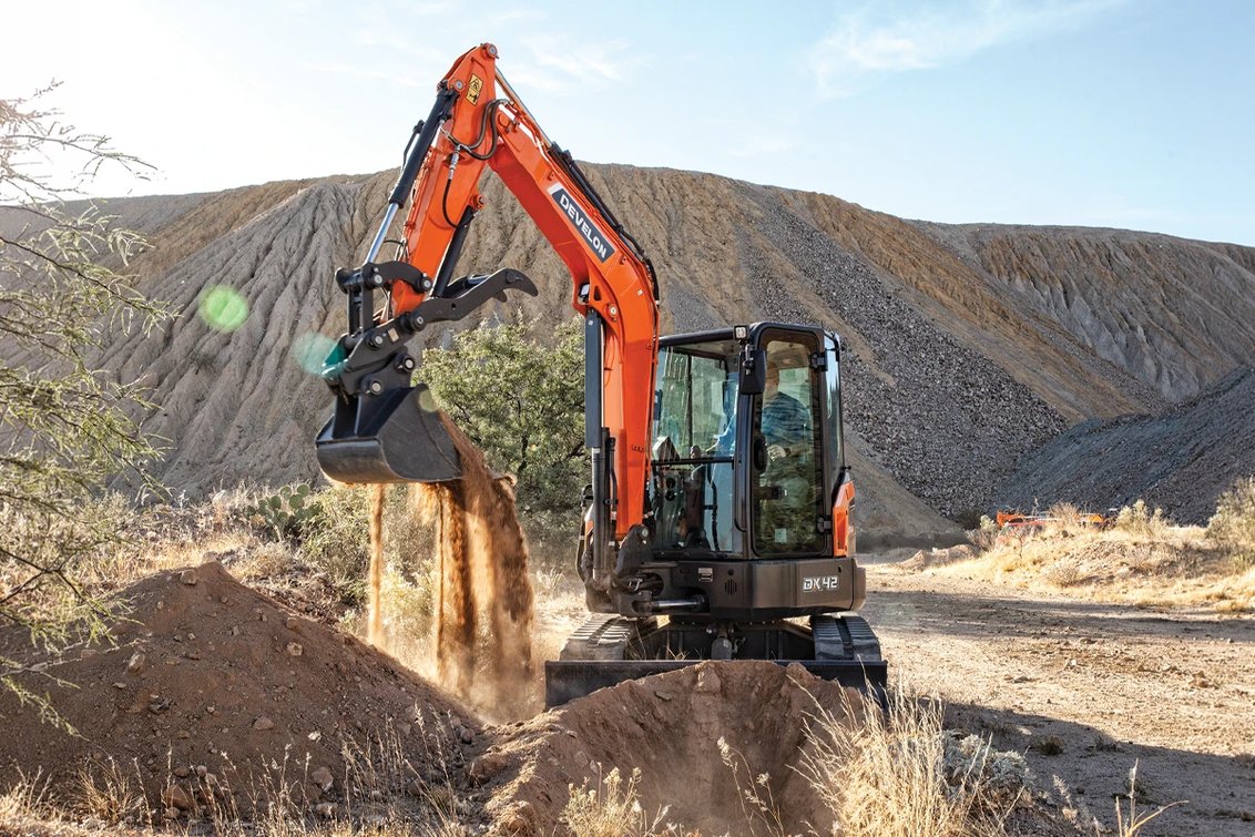 DEVELON DX42-7 Mini Excavator digging a hole