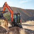 DEVELON DX42-7 Mini Excavator digging a hole