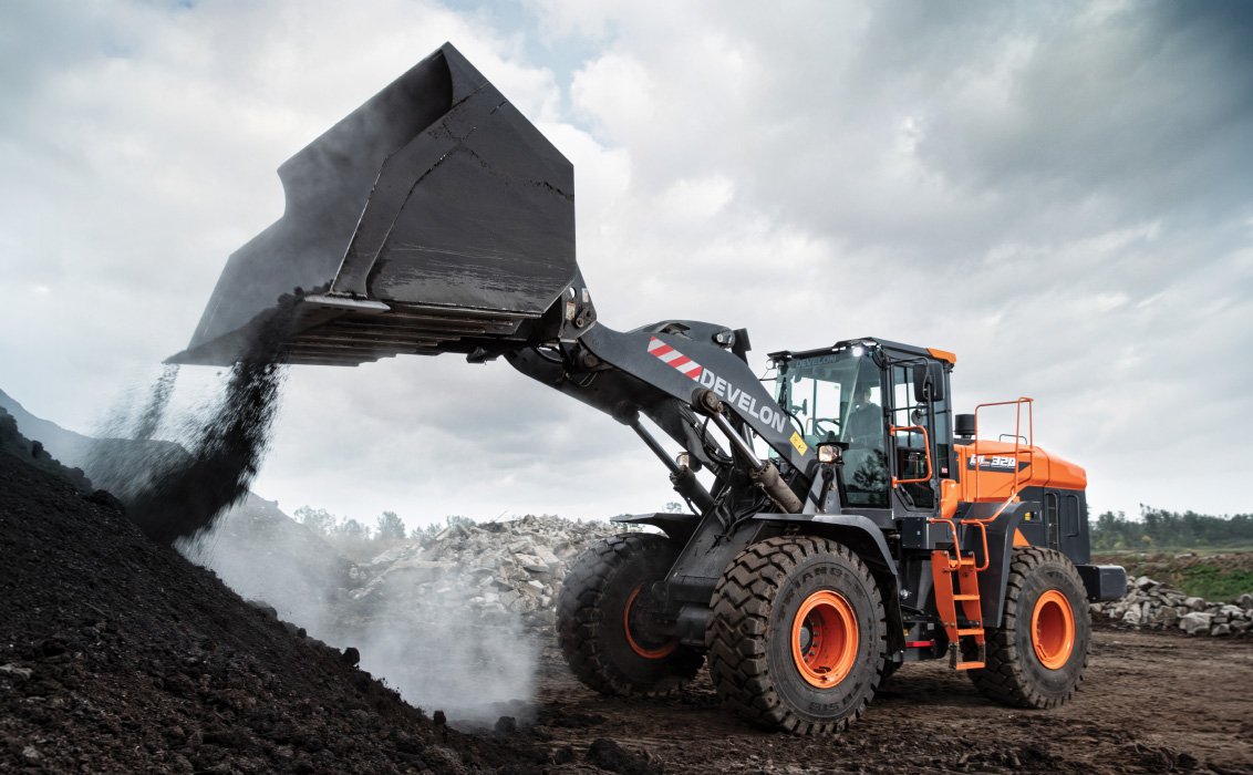 DEVELON DL320-7 Wheel Loader dumping a load of dirt