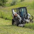 Bobcat T76 Compact Track Loader cutting field grass