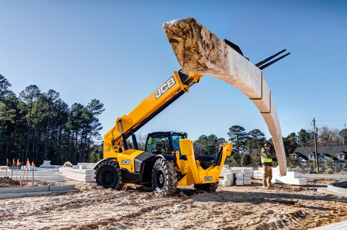 JCB 510-56 Telehandler lifting heavy load on construction site