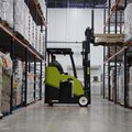 Clark SES15 Electric Stand-Up Cushion Forklift in a warehouse