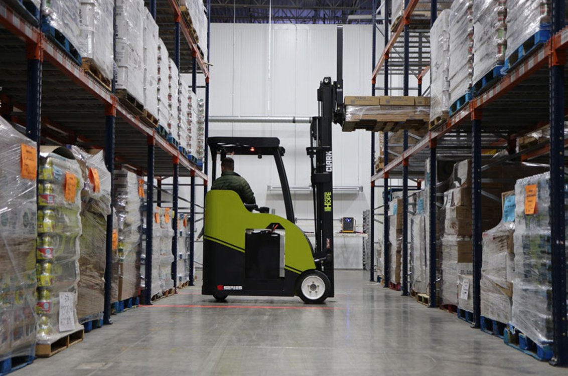 Clark SES15 Electric Stand-Up Cushion Forklift in a warehouse