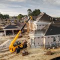 JCB 509-42 Telehandler showing reach capability to roof