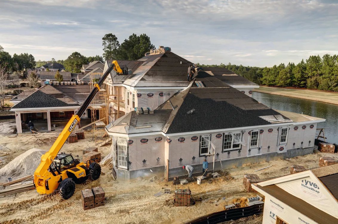 JCB 509-42 Telehandler showing reach capability to roof