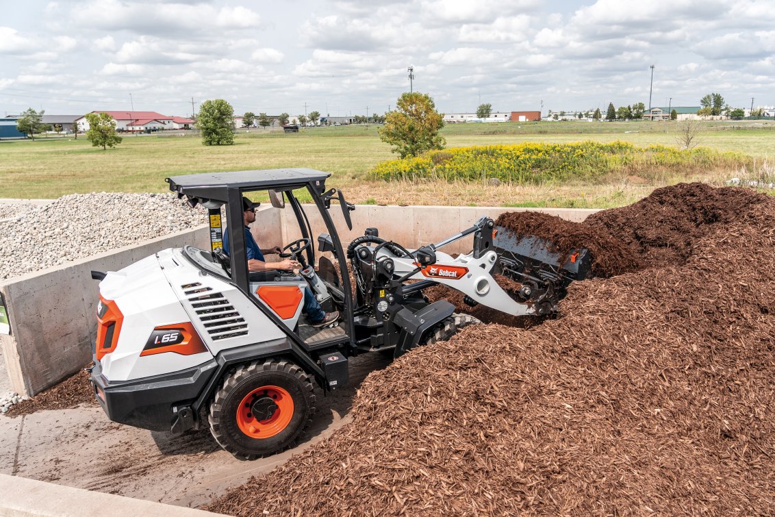 Bobcat L65 Compact Wheel Loader loading mulch