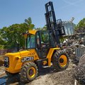JCB 950 Rough Terrain Forklift moving scrap metal