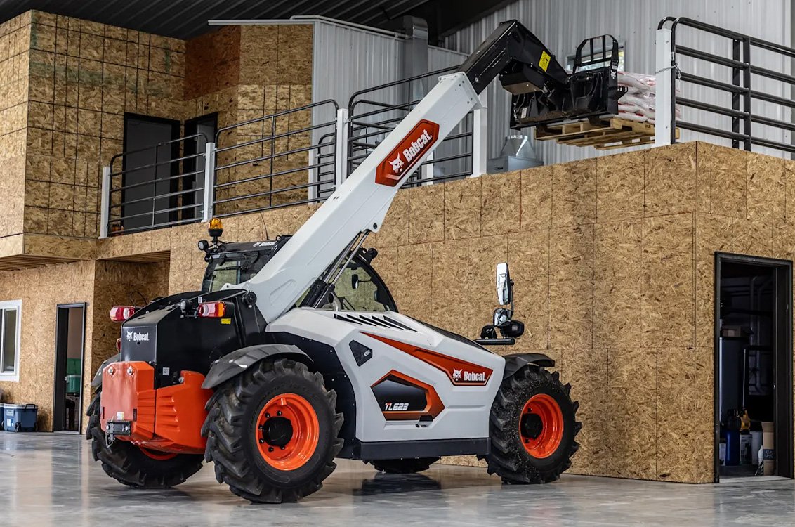 Bobcat TL623 Telehandler lifting to a high storage space