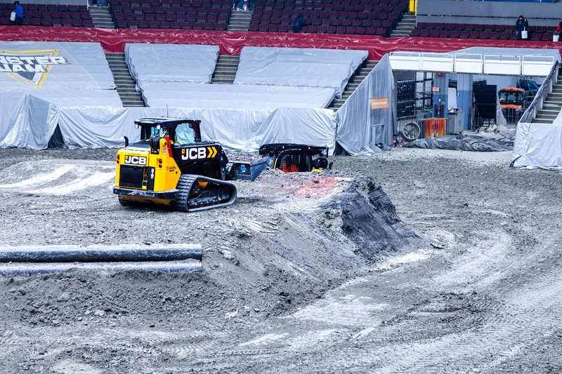 JCB track loaders fix up the track at Monster Jam Vancouver to prepare for a show.